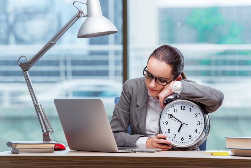 Businesswoman failing to meet her deadlines in business concept